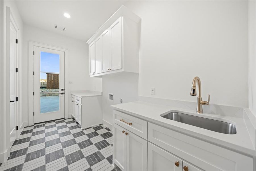 Laundry room with cabinet space, washer hookup, and recessed lighting