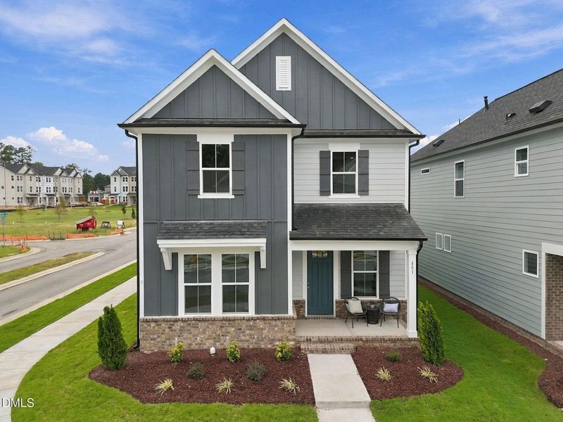 Front exterior of a new home in Forestville Yard, Knightdale, NC, highlighting curb appeal (Image 31). Front exterior of a new home in Forestville Yard, Knightdale, NC, highlighting curb appeal (Image 31).