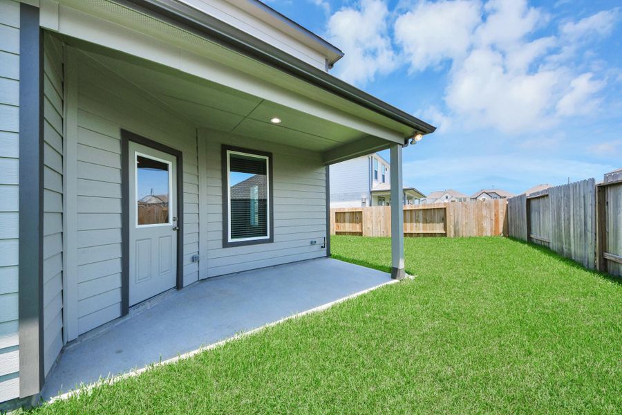 Come and see this spacious backyard with its beautiful covered patio. There is plenty of room for the kids to play and adults to relax. Perfect for your outdoor living space, patio furniture, bbq pit, and so much more. The possibilities are endless! Sample photo of completed home with similar floor plan. Actual colors and selections may vary. Come and see this spacious backyard with its beautiful covered patio. There is plenty of room for the kids to play and adults to relax. Perfect for your outdoor living space, patio furniture, bbq pit, and so much more. The possibilities are endless! Sample photo of completed home with similar floor plan. Actual colors and selections may vary.