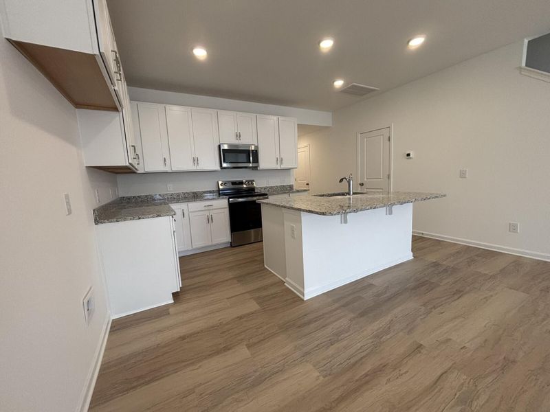 Furnished interior view inside a new home in CraigStone, Woodruff (Image 5).