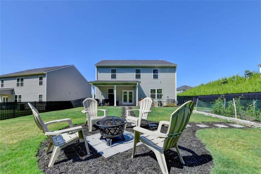 Exterior details and patio area of a home in Twin Lakes, Hoschton (Image 24).
