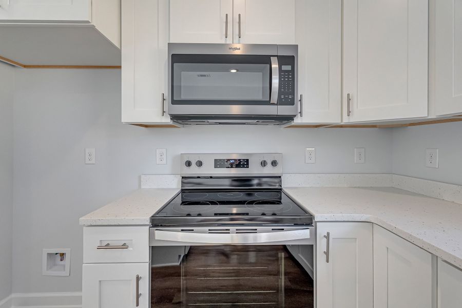 Furnished interior view inside a new home in Live Oak Cottages, Freeport (Image 9).