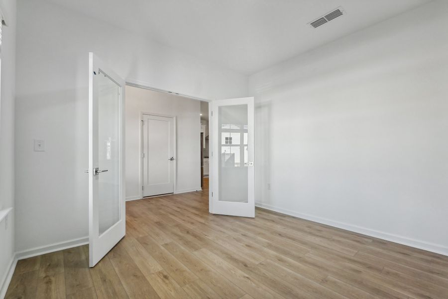 Representative unfurnished interior of a home built from the Macon by Ashton Woods in Rowland's Grant, Fuquay Varina (Image 34).