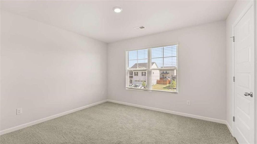 Spacious, unfurnished interior of a new home in Preserve at Dove Creek, Statham (Image 22).