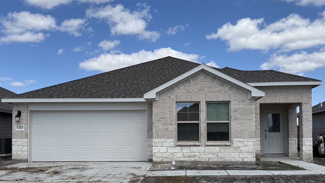 Front exterior of a new home in London Towne, Corpus Christi, TX, highlighting curb appeal (Image 1).
