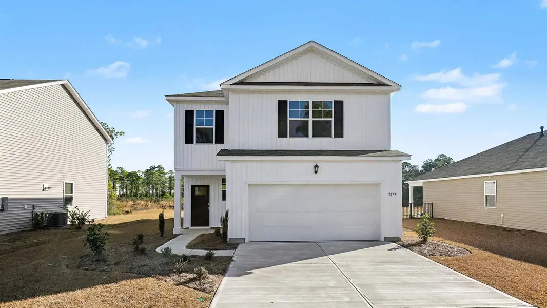 Front exterior of a new home in Ridgefield, Conway, SC, highlighting curb appeal (Image 1).