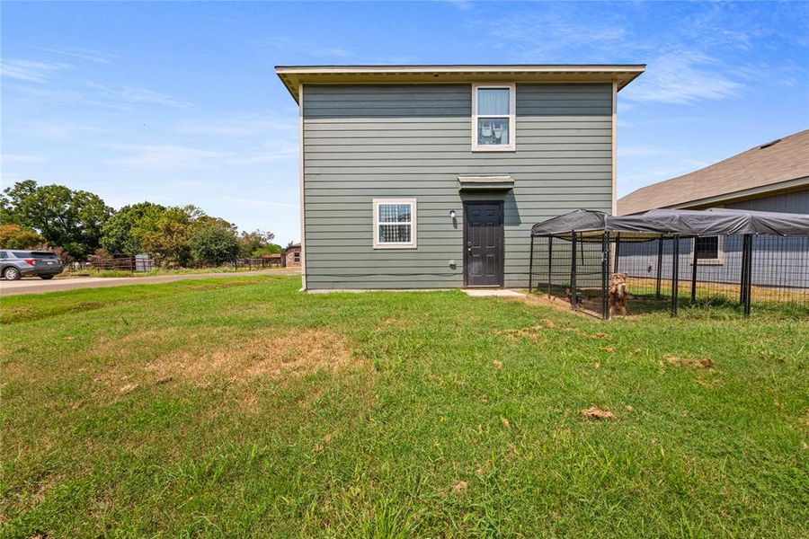 Back view of home, large yard & corner lot