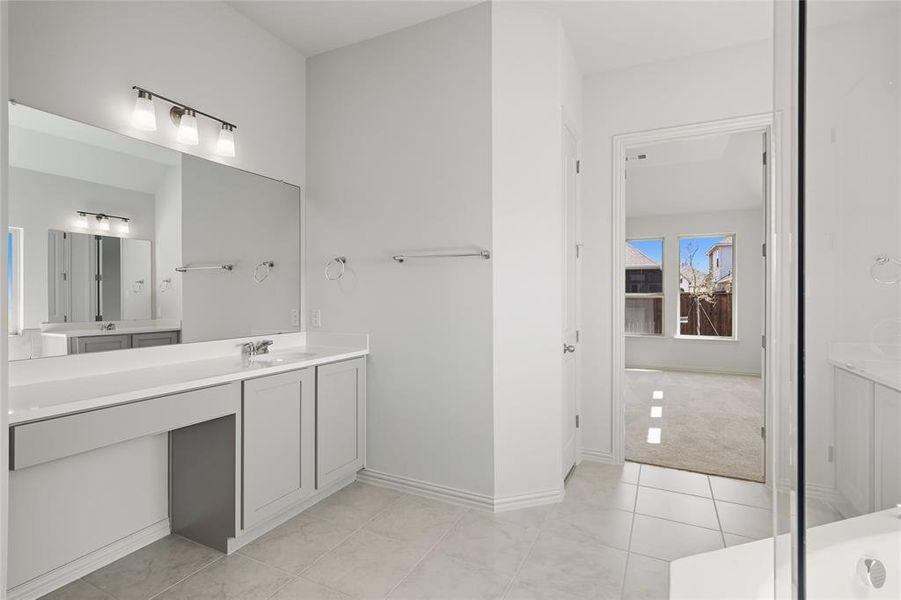 Bathroom with vanity and light tile patterned floors Bathroom with vanity and light tile patterned floors