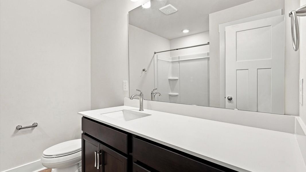 Stylish guest bathroom with superior design and thoughtful storage solutions