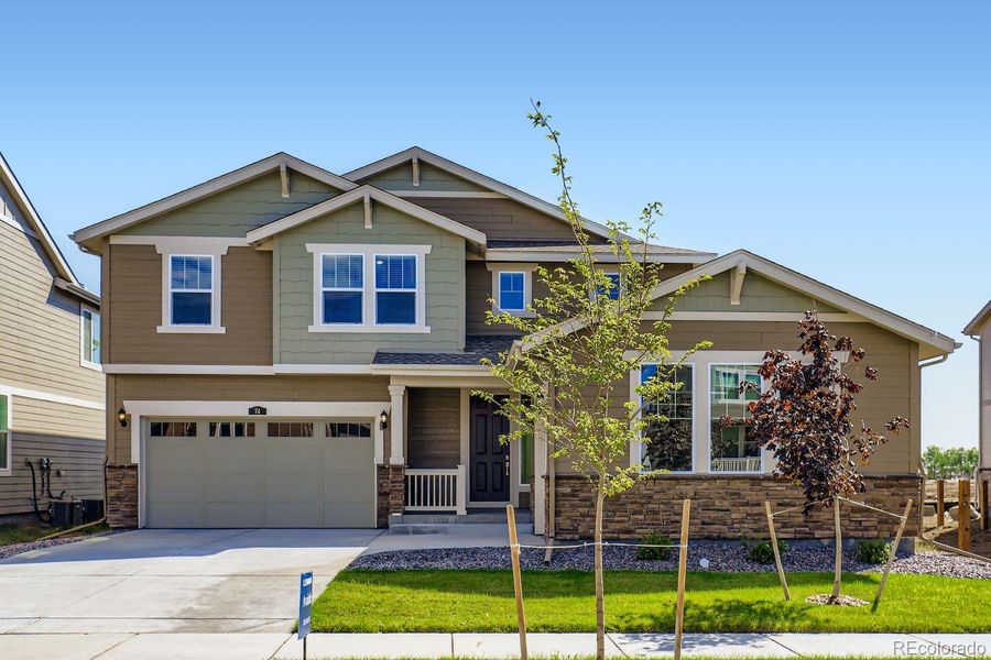 Front exterior of a new home in Brighton Crossings: The Grand Collection, Brighton, CO, highlighting curb appeal (Image 14).