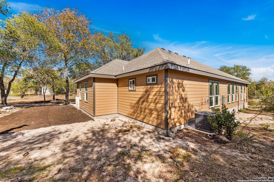 Exterior details and patio area of a home in , Elmendorf (Image 17).