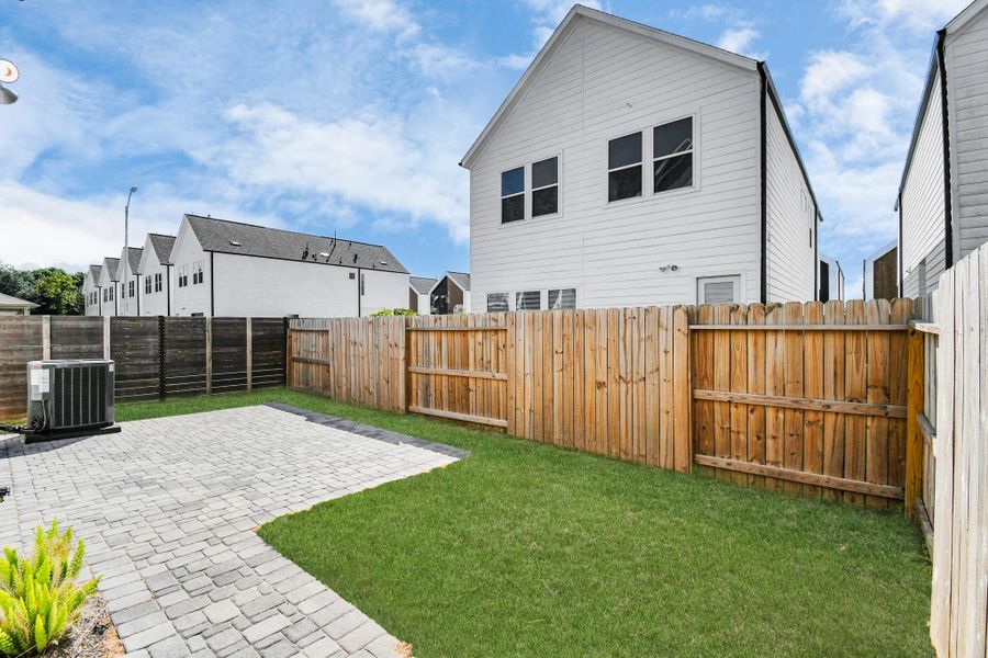Exterior details and patio area of a home in Antigua, Houston (Image 28).