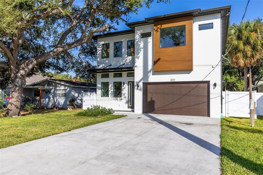 Front exterior of a new home in , Tampa, FL, highlighting curb appeal (Image 1).