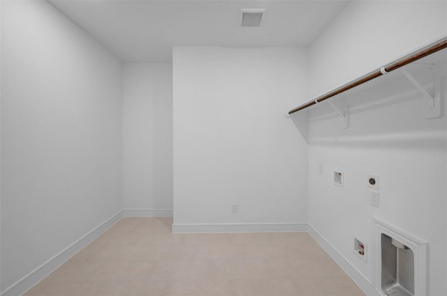 Laundry room (*Photo not of actual home and used for illustration purposes only.)