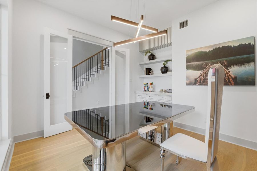 Through the double doors, the office also offers built-ins for decor and storage to meet your home office needs.