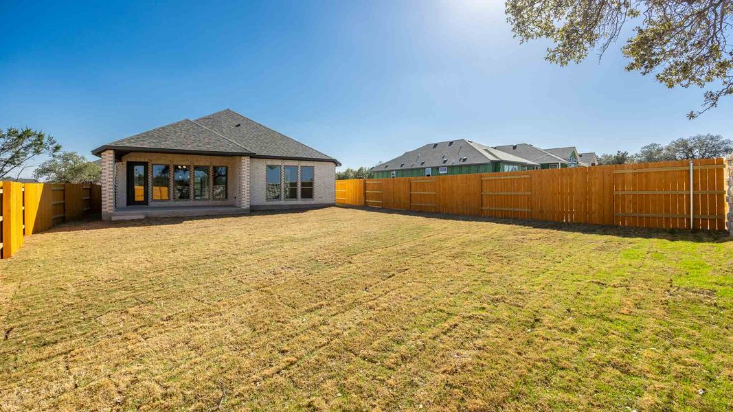 Exterior details and patio area of a home in Parkside On The River, Georgetown (Image 3).