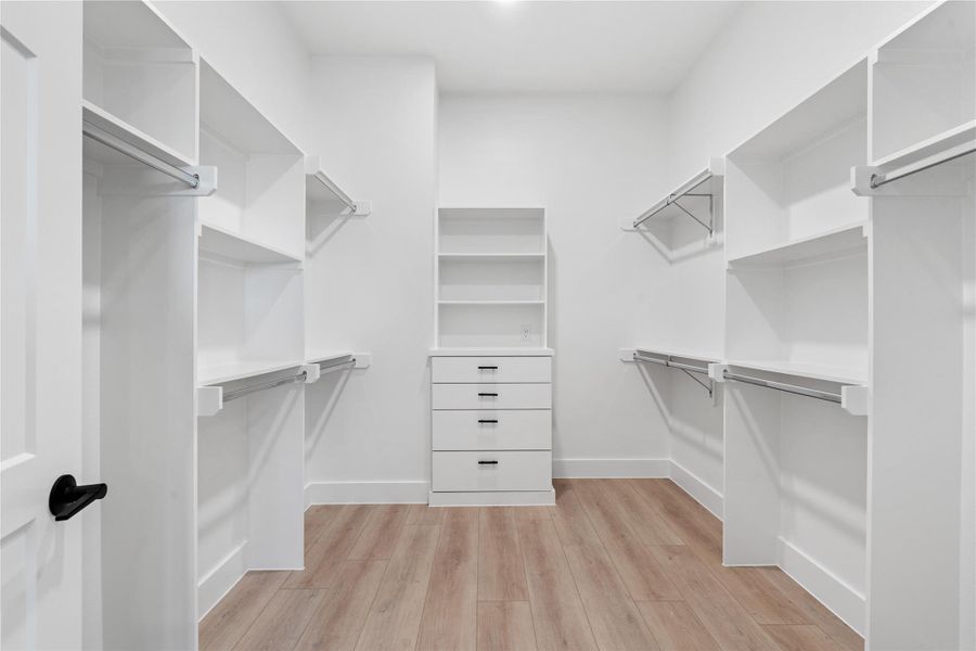 A purpose-built closet designed for organization and visibility, featuring symmetrical shelving and integrated drawer storage that supports both efficiency and long-term functionality.