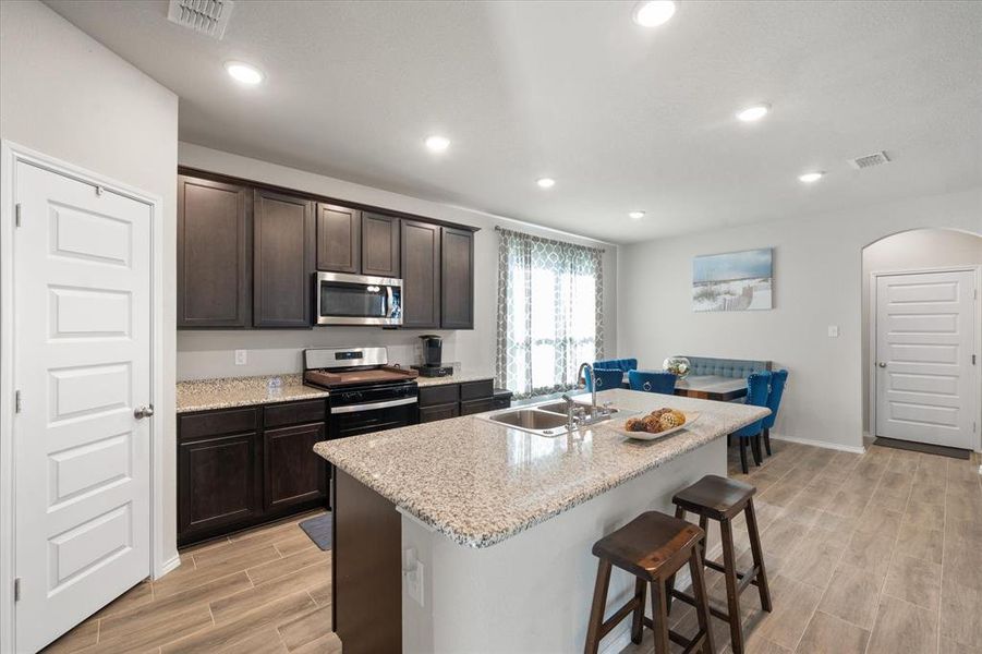 Beautiful light and open kitchen that sets the heart of this home