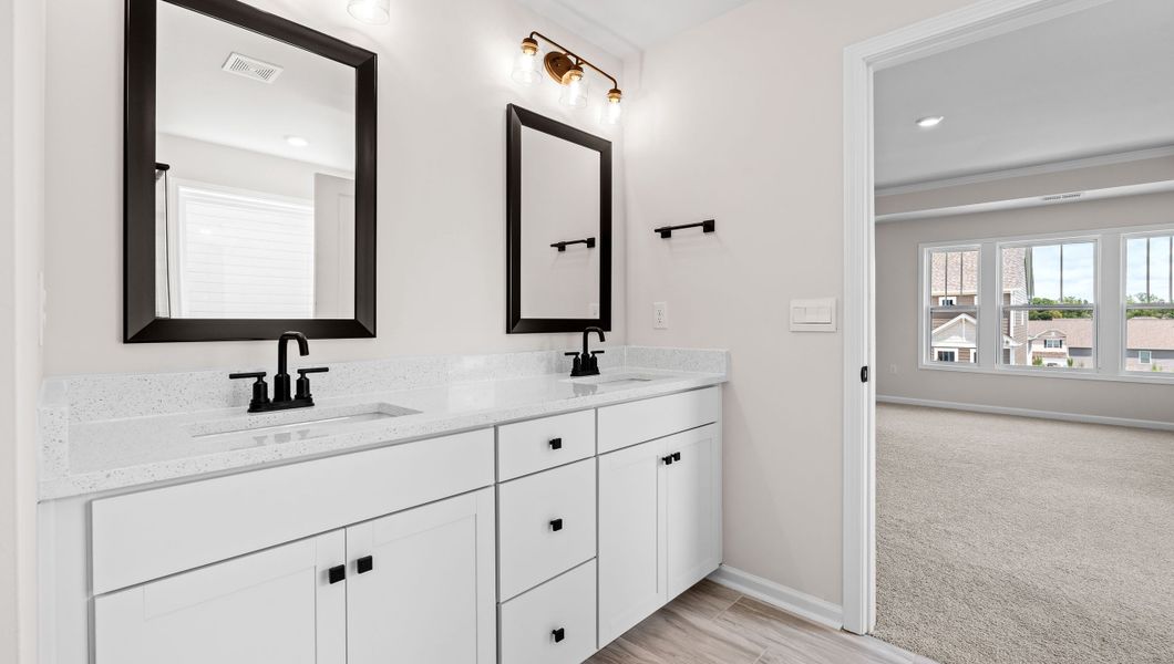 Representative furnished interior of a home built from the VERWOOD by D.R. Horton in Adams Glen, Greenville (Image 11).