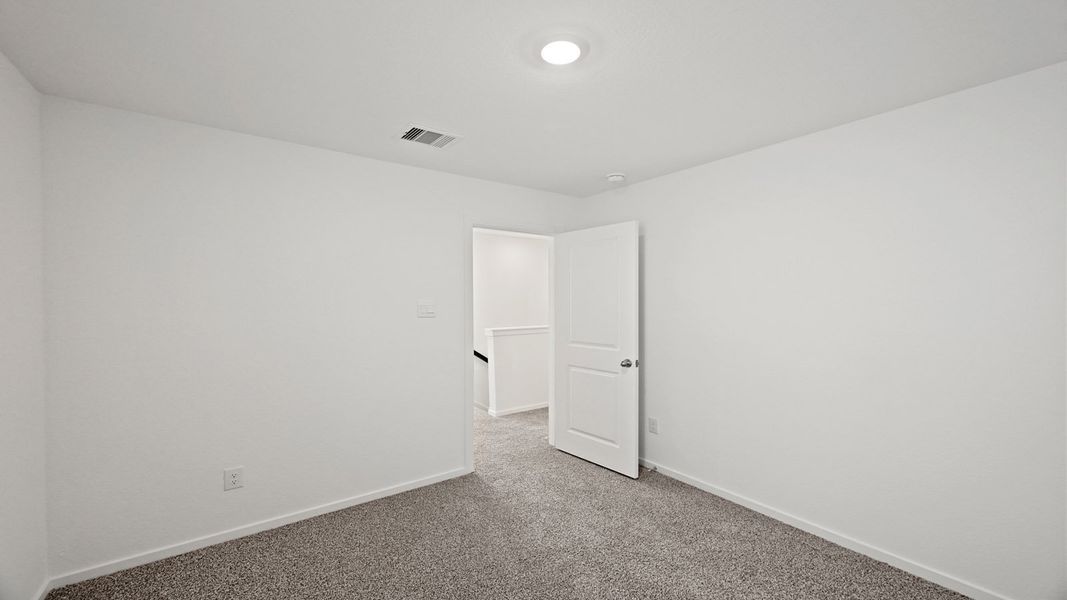 Spacious, unfurnished interior of a new home in Bridges on Lake Houston Villas, Humble (Image 11).
