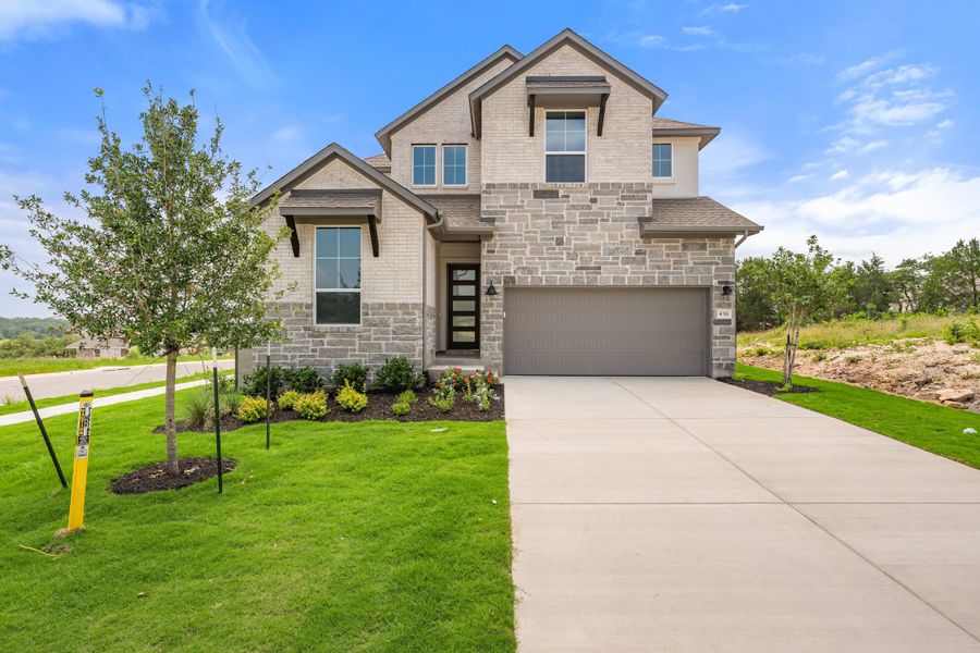 Front exterior of a new home in Wolf Ranch, Georgetown, TX, highlighting curb appeal (Image 27).