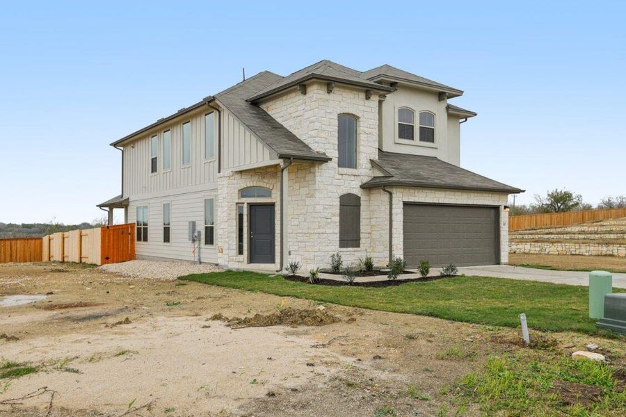 Exterior details and patio area of a home in Saddle Ridge at Wildhorse Ranch, Manor (Image 3). Exterior details and patio area of a home in Saddle Ridge at Wildhorse Ranch, Manor (Image 3).