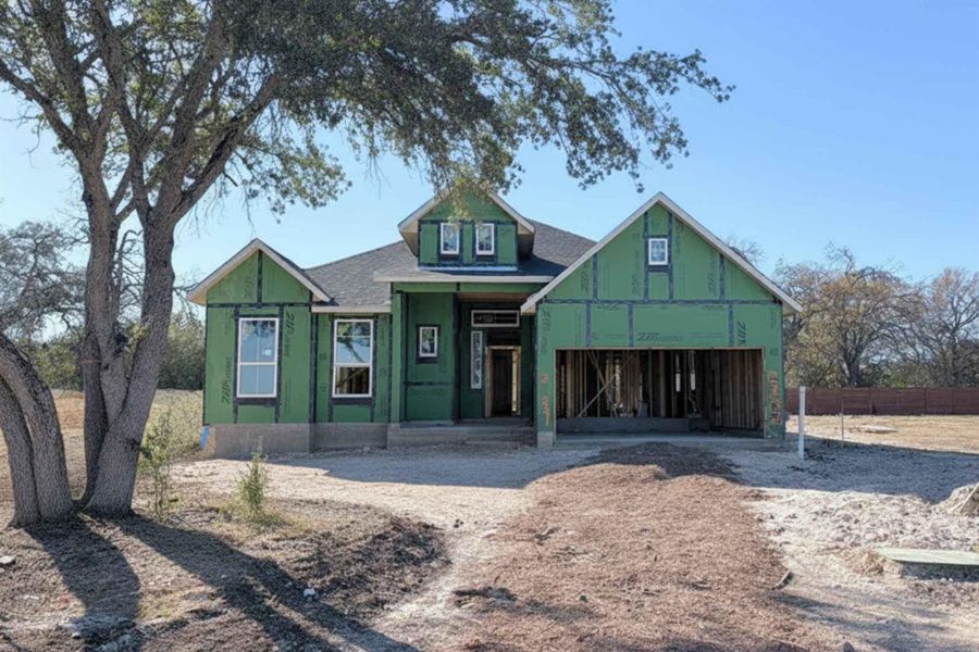 Property under construction featuring a porch and a shingled roof