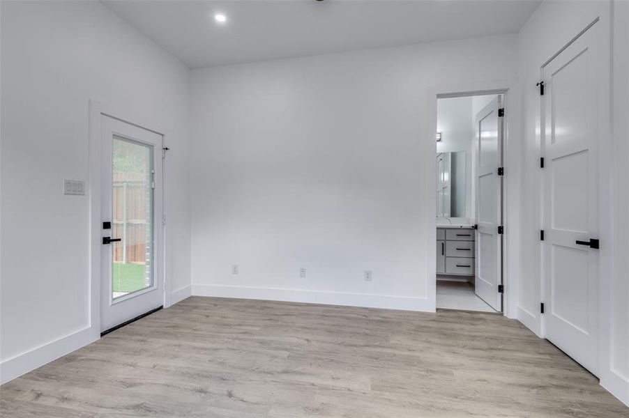 Unfurnished room with light wood-type flooring