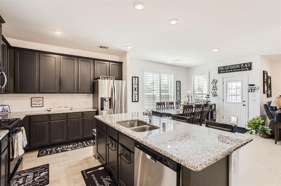 Another view of the island kitchen and breakfast nook.