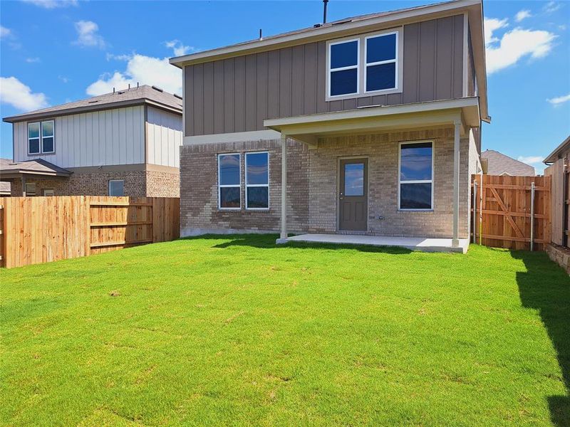 Front exterior of a new home in Sunfield, Buda, TX, highlighting curb appeal (Image 17). Front exterior of a new home in Sunfield, Buda, TX, highlighting curb appeal (Image 17).