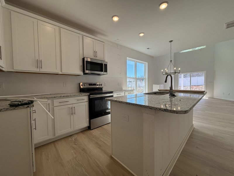 Furnished interior view inside a new home in CraigStone, Woodruff (Image 4). Furnished interior view inside a new home in CraigStone, Woodruff (Image 4).