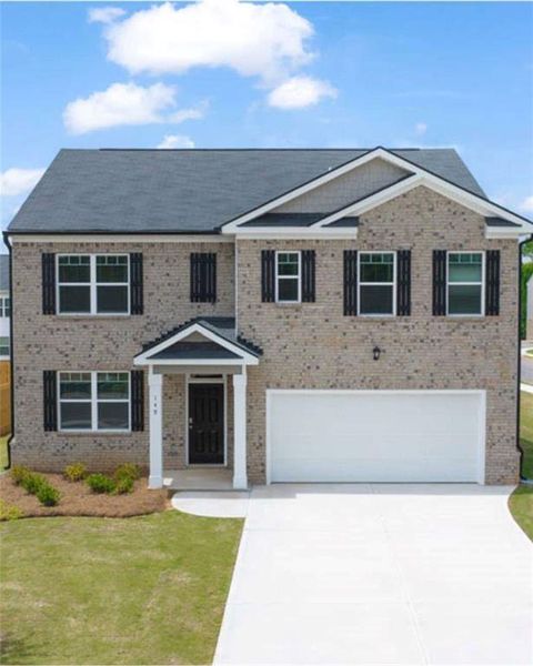 Front exterior of a new home in The Reserve at Calcutta, Stockbridge, GA, highlighting curb appeal (Image 28).