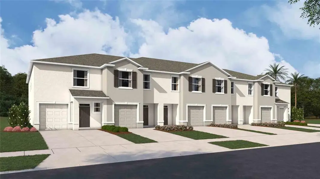 Front exterior of a new home in Towns at Woodsdale, Wesley Chapel, FL, highlighting curb appeal (Image 1). Front exterior of a new home in Towns at Woodsdale, Wesley Chapel, FL, highlighting curb appeal (Image 1).