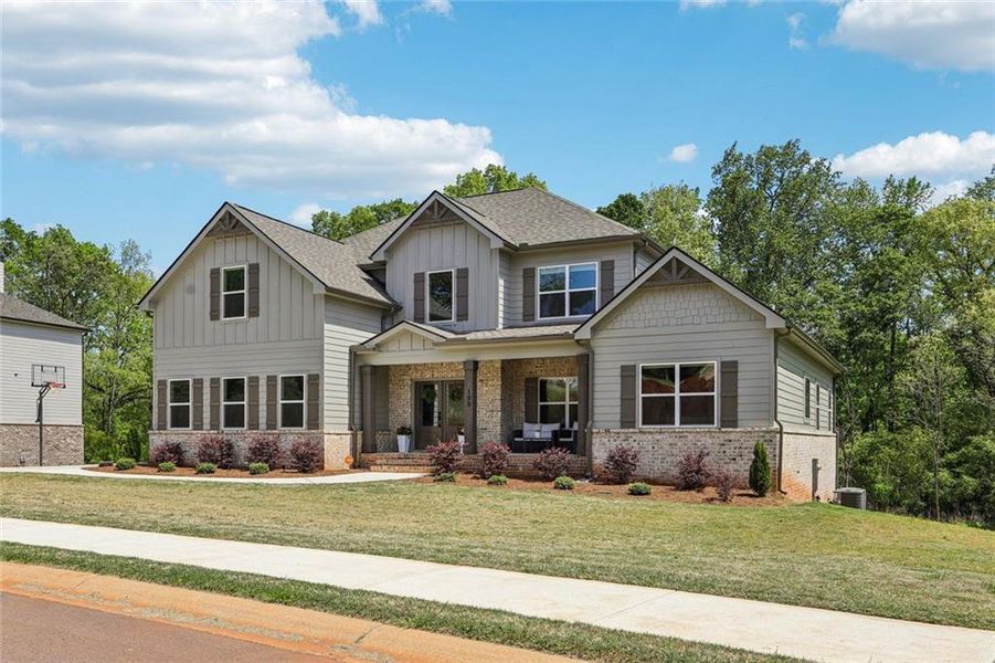 Front exterior of a new home in , Hoschton, GA, highlighting curb appeal (Image 28).