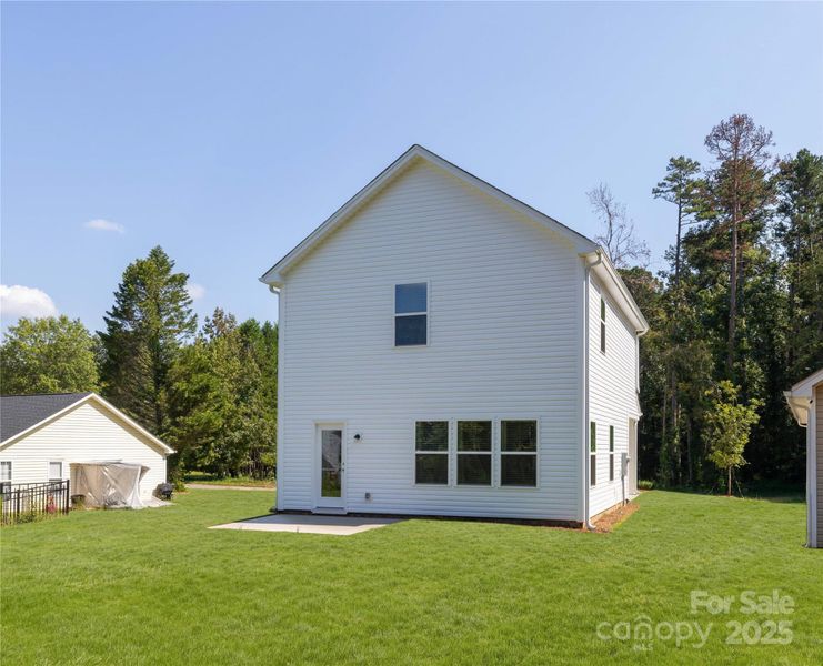 Front exterior of a new home in , Charlotte, NC, highlighting curb appeal (Image 1).