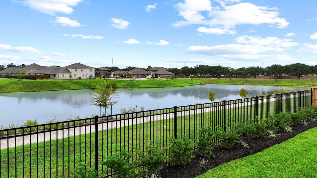 Enjoy peaceful waterfront views right from your backyard, with wrought iron fencing that frames the scenic pond and manicured walking trails—offering a serene backdrop for everyday living.  This stunning trinity Floor Plan by CastleRock Communities!