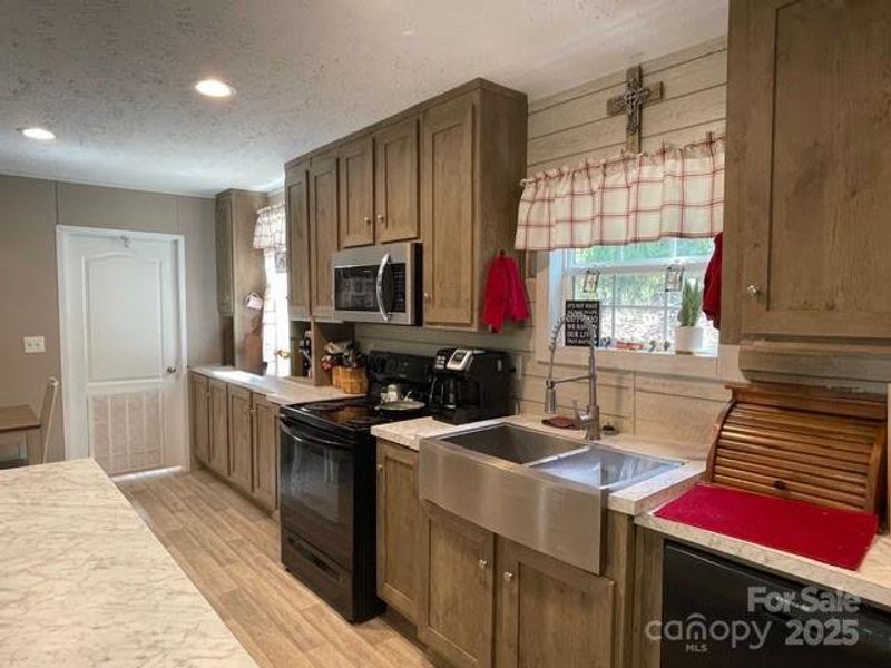 Kitchen has lots of cabinetry and counterspace including a Kitchen Island