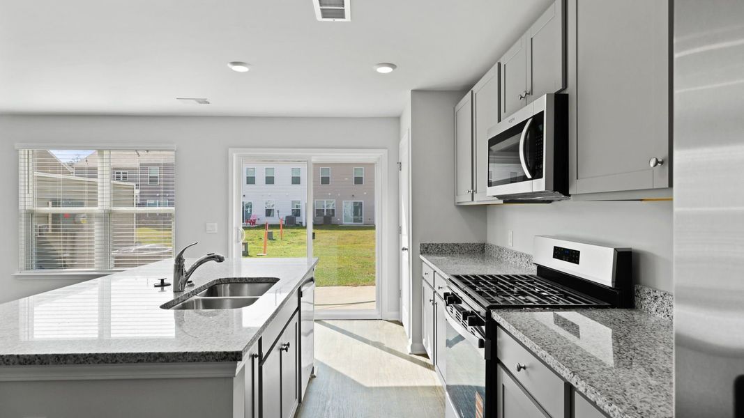 Representative furnished interior of a home built from the DENMARK by D.R. Horton in Pine Hills Townhomes at Cane Bay, Summerville (Image 6).
