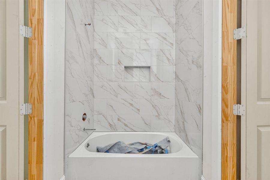 Tiled shower in jack and jill bathroom