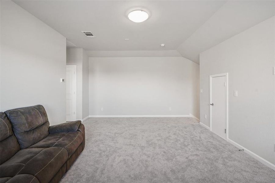 Living area featuring carpet flooring