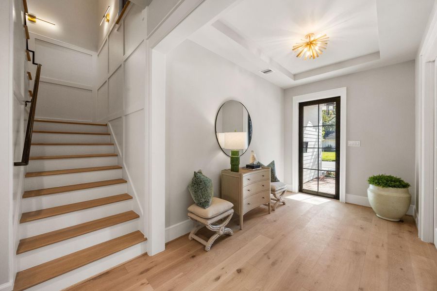 Wide front entry leads to the staircase before reaching the Family Room.