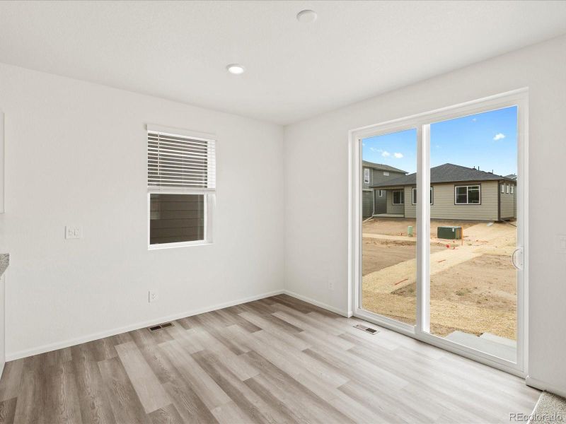 Spacious, unfurnished interior of a new home in Ridgeline Vista: The Flora Collection, Brighton (Image 27).