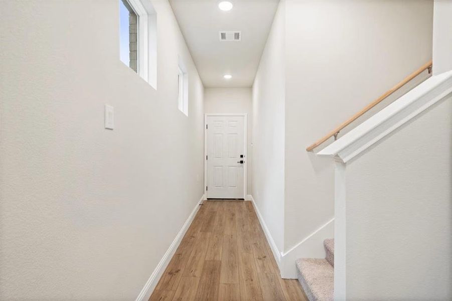 Hall with light wood-type flooring