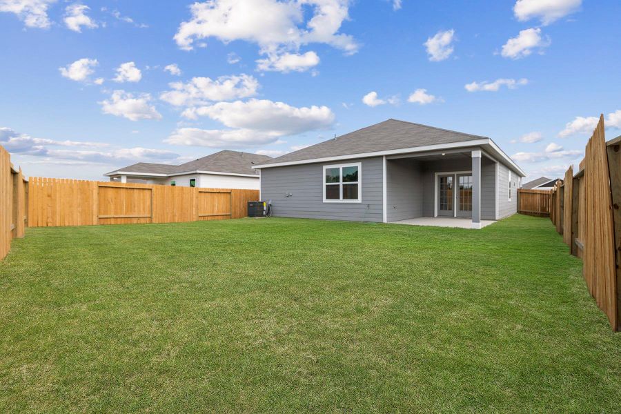 Exterior details and patio area of a home in Sweetwater Ridge, Conroe (Image 2).