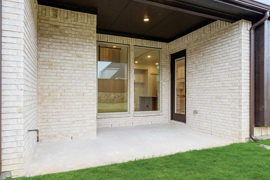 Exterior details and patio area of a home in Windsong Ranch Classic 61, Prosper (Image 21). Exterior details and patio area of a home in Windsong Ranch Classic 61, Prosper (Image 21).