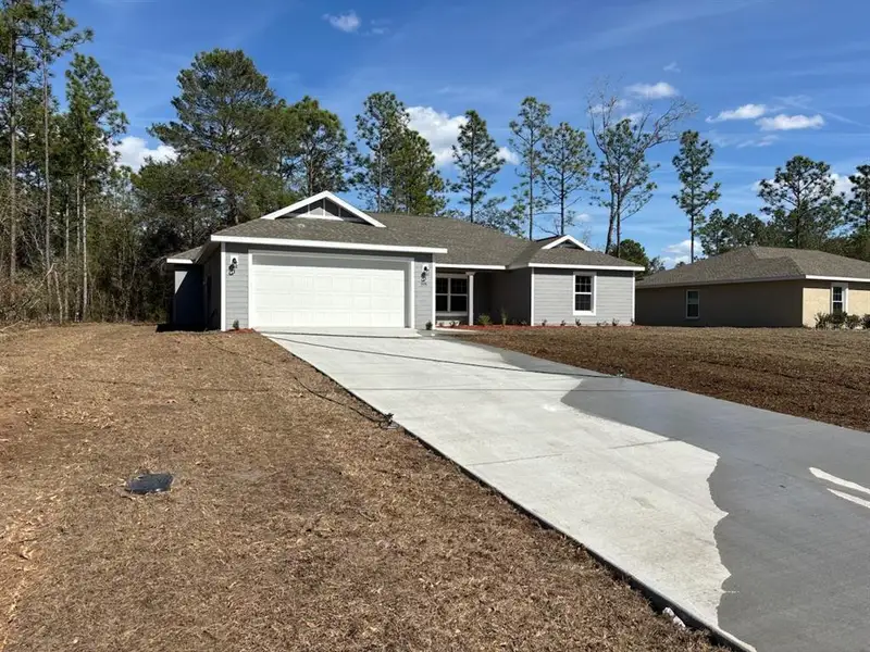 Front exterior of a new home in , Citrus Springs, FL, highlighting curb appeal (Image 2). Front exterior of a new home in , Citrus Springs, FL, highlighting curb appeal (Image 2).