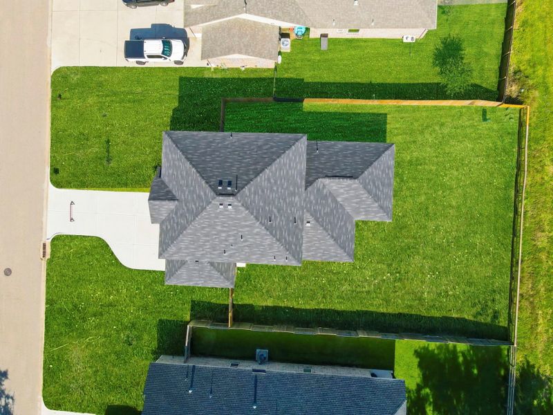 A stunning aerial perspective showcases the full layout of the home and spacious backyard, giving a clear view of the property’s ideal position and privacy.