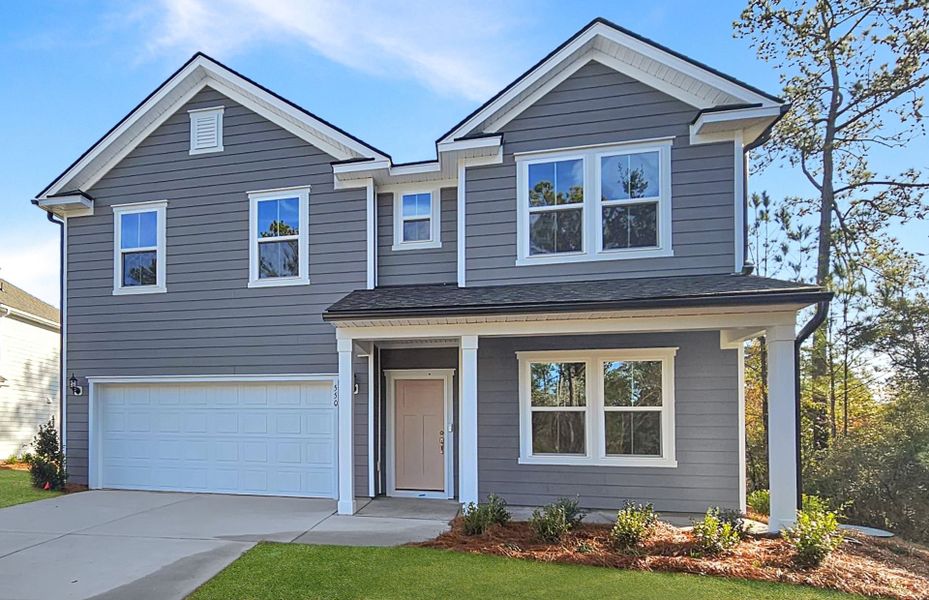 Front exterior of a new home in Solserra, Shallotte, NC, highlighting curb appeal (Image 2). Front exterior of a new home in Solserra, Shallotte, NC, highlighting curb appeal (Image 2).