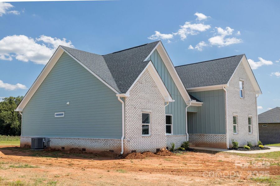 Front exterior of a new home in , Statesville, NC, highlighting curb appeal (Image 12).