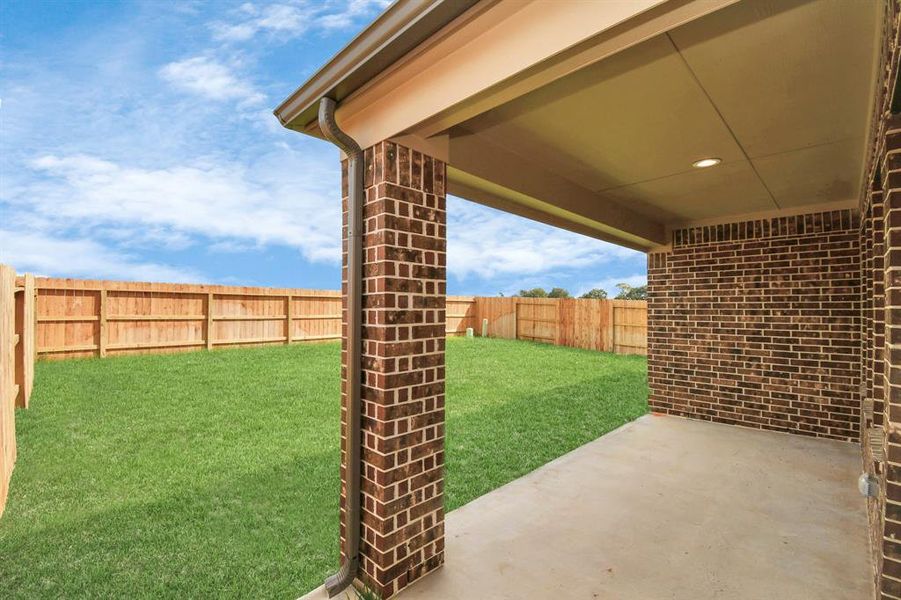 Experience outdoor living at its finest on this expansive covered patio, thoughtfully designed for BBQs and delightful outdoor dining